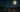 a white ceramic mug with hot tea on a wooden table with mountains in the background and a full moon in the night sky