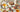 a tea party table with all different pastries a white and floral tea pot and small bouquets