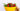 ripe red strawberries in a yellow ceramic mug