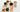 various white mugs of different colored tea beverages on a white background