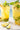 Glasses of a bright tea mocktail with pineapple and mint made with Full Moon tea Company loose leaf cold-brewed tea.