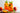 two tall clear glasses filled with a coral colored iced beverage with sliced peaches and herbs