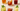 a variety of different iced beverages in clear glass mugs and cups with sliced citrus and herbs