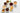 various white mugs of different colored tea beverages on a white background