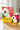 Two packages of Full Moon Tea Company Hibiscus Lavender tea on a wooden surface with a blurred background.