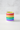 Colorful striped mug with rainbow pattern on a white background