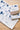 Towel with blue animal patterns on a wooden surface