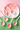 Set of pink ceramic spoons with strawberry design on a pink and green background