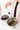 Two stainless bowls of tea ingredients being blended.