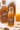 Two jars of Wildflower Honey from Tennessee for loose leaf tea with a honey dipper and a candle